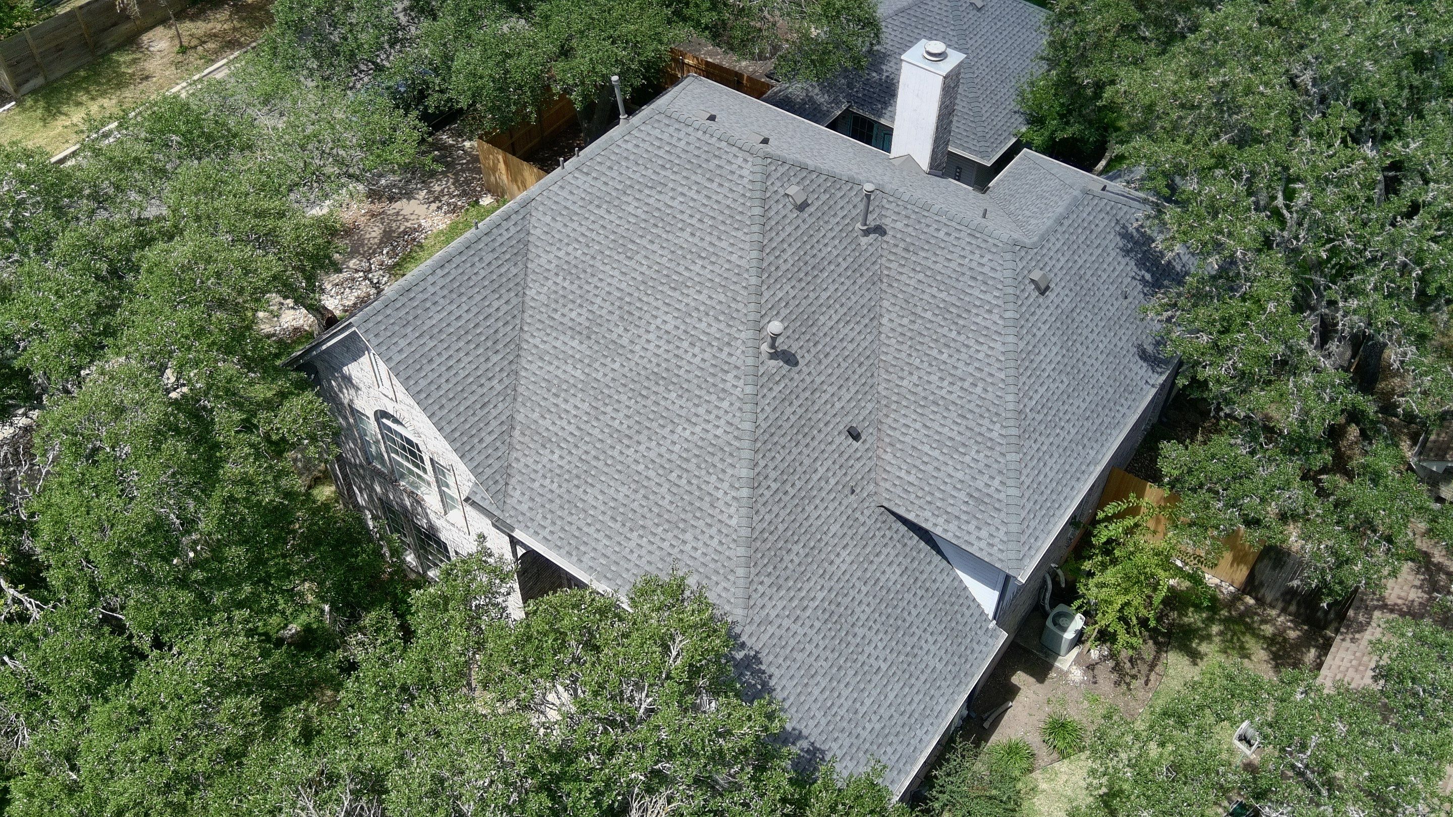 Aerial view of a finished roof replacement project
